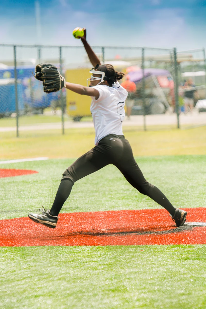 Baseball pitcher captured in motion on the field.